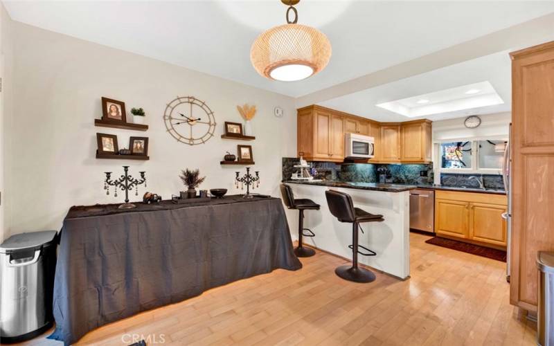 Dining Room is Open to the Remodeled Granite Kitchen with Breakfast Bar