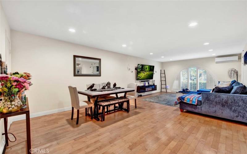 Huge Living Room with Recessed Lighting, Dual Pane Windows, Plantation Shutters, and Hardwood Flooring