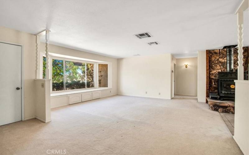 Large windows bringing the outside into the living room.