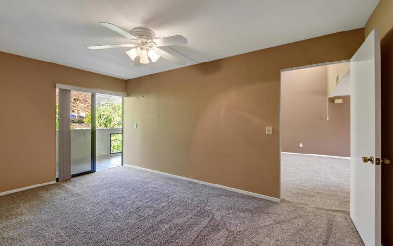 GUEST BEDROOM ANGLED TO PATIO AND LIVING