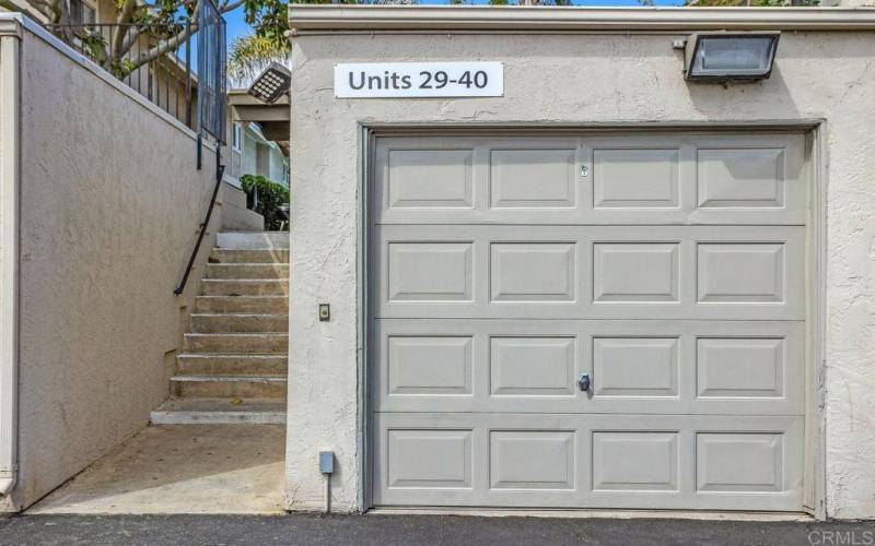 One car garage with opener located to the right of stairs to pool.