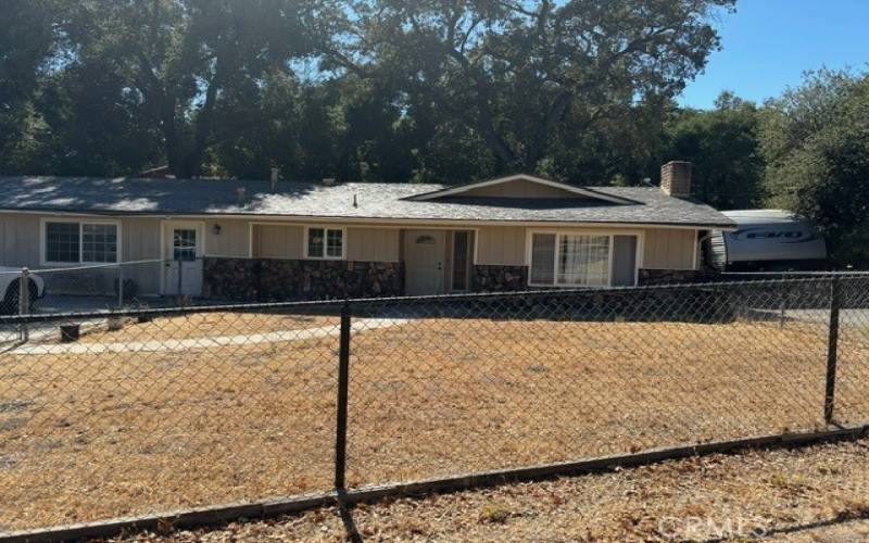 Fenced portion of front yard, RV parking on side