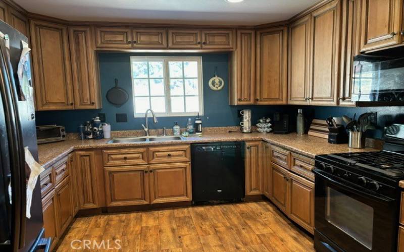 Kitchen has maple cabinets in good shape