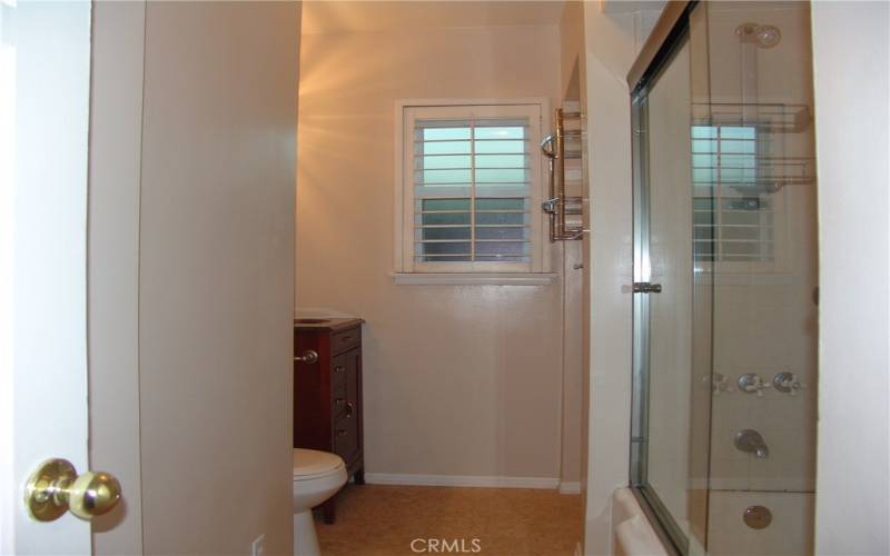 Hall bathroom with bathtub and shower