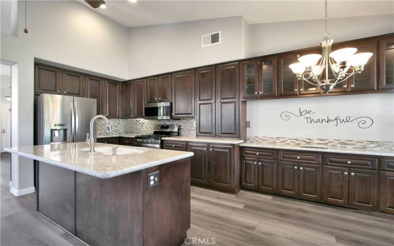 Classy stained cabinets and quartz counters