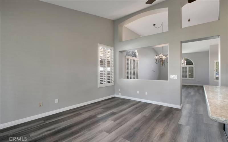 View back showing open wall separating family room and dining area