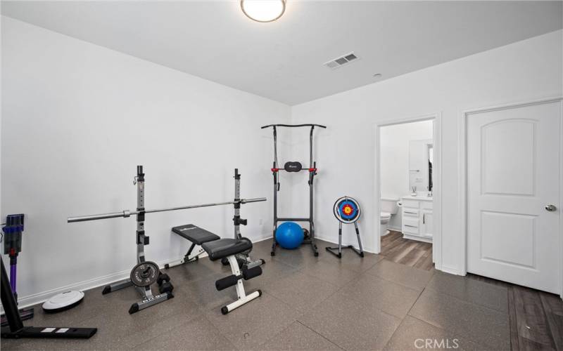 Room with enclosed bathroom after dining area.