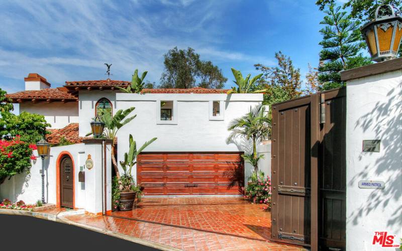 2 car attached garage and parking for guests inside gate