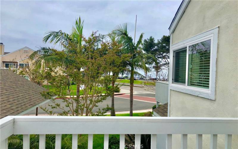 This is a peek a boo view of the ocean from the Master Bedroom Deck!  Sip your coffee and listen to the waves!