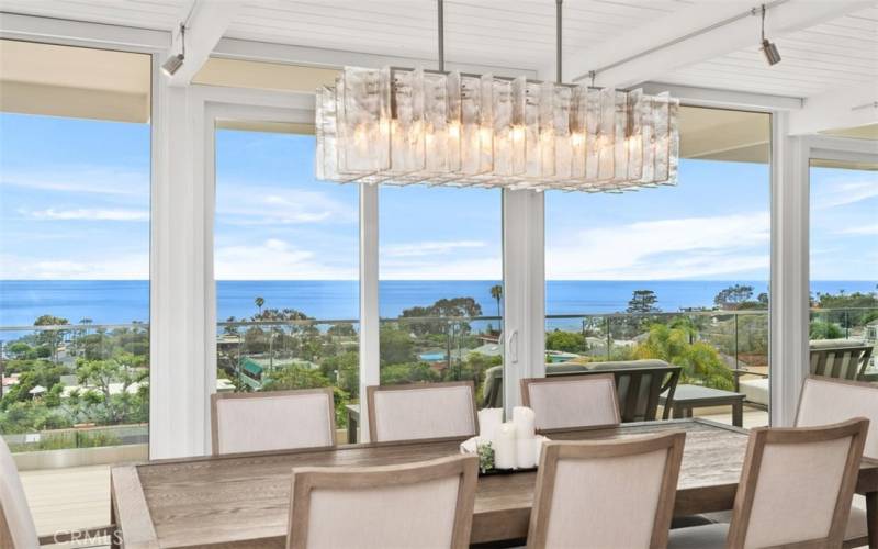 Dining area looking out to upper deck and Pacific Ocean.