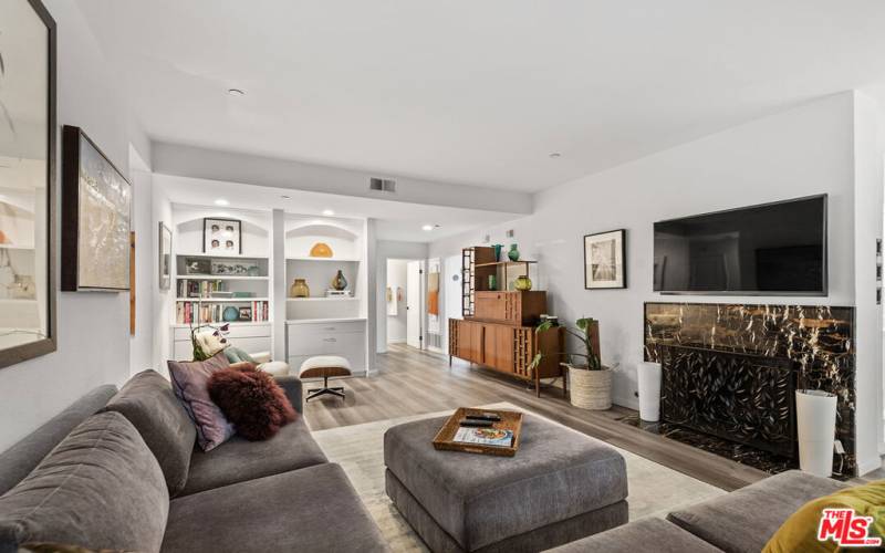 Living room with built-ins and fireplace