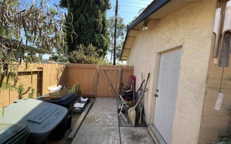 Side gate for unit 510, leading to rear yard and garage door access to one of the two garages