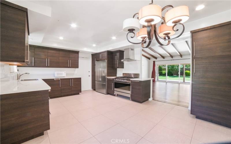 Gorgeous kitchen with view looking through to entertainer's patio and yard. Door leads to garage.