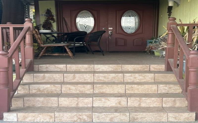 Beautifully tiled front porch entry