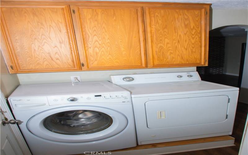 Laundry area next to the garage.