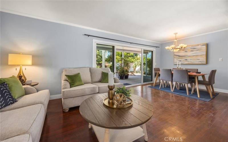 Front door opens to an inviting living room with sliding glass doors that allows plenty of natural light.