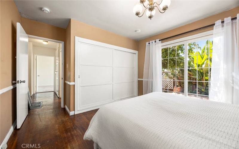 Another view of bedroom 1. Closet has wood sliding doors.