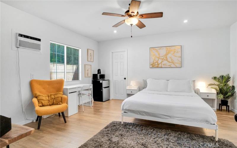 2 downstairs junior primary suites with sparkling windows, lighted ceiling fans, private entries (one offers access to the backyard); plus, private en suite bathrooms with white vanities, undermount basins, touch screen back-lit mirrors and tile floors.