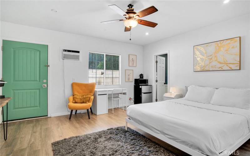 2 downstairs junior primary suites with sparkling windows, lighted ceiling fans, private entries (one offers access to the backyard); plus, private en suite bathrooms with white vanities, undermount basins, touch screen back-lit mirrors and tile floors.