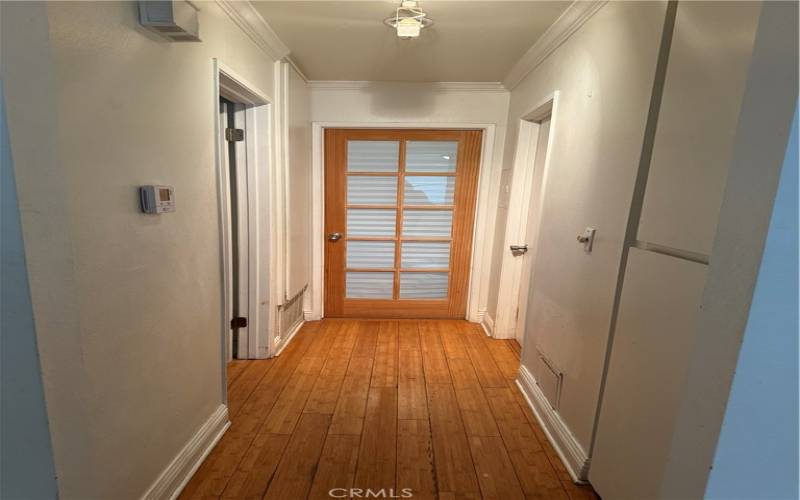 Hallway, Master with the wooden door and 2nd bedroom to the left, Bathroom to the right