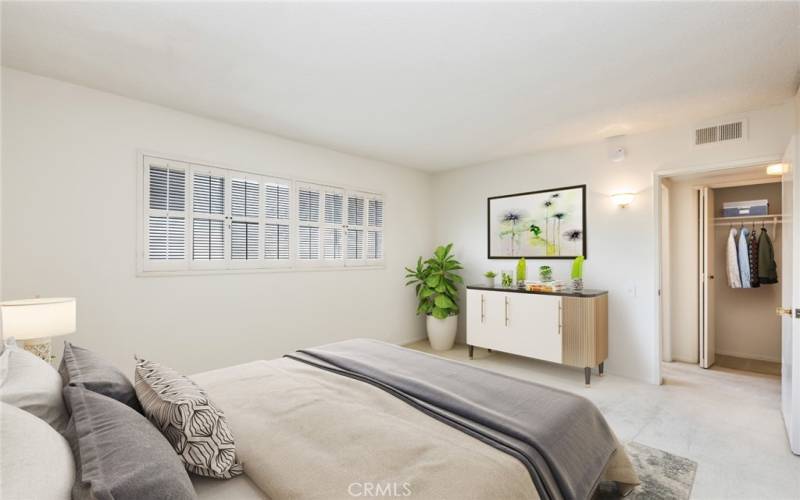 Virtually staged primary bedroom with private bath