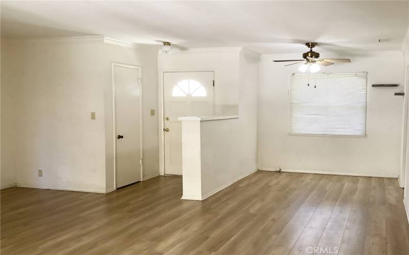 Front door opens to bright entry with guest closet & plank style floors