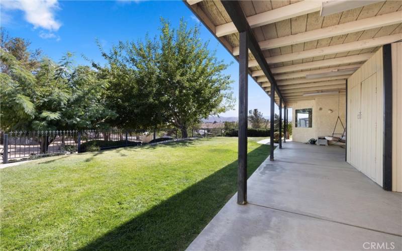 Back porch with large grassy area.