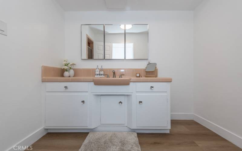 Second bath off of the hall features great 50's tile and a shower!