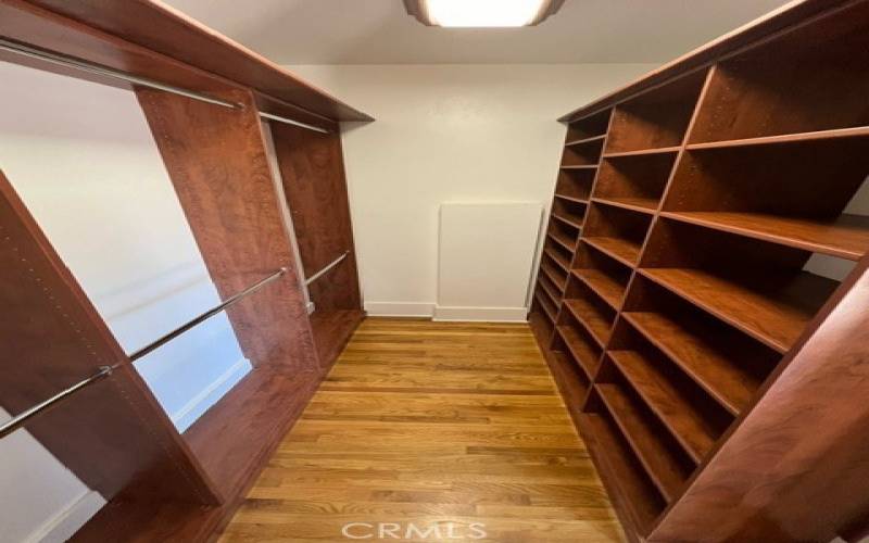 Primary bedroom closet is large and nicely organized.