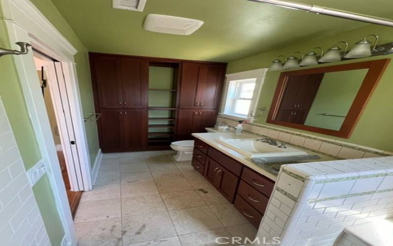 Primary bathroom with extra storage and lots of counter space.
