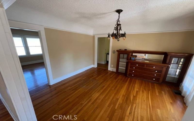 Dining room with built-ins and a period appropriate chandelier.