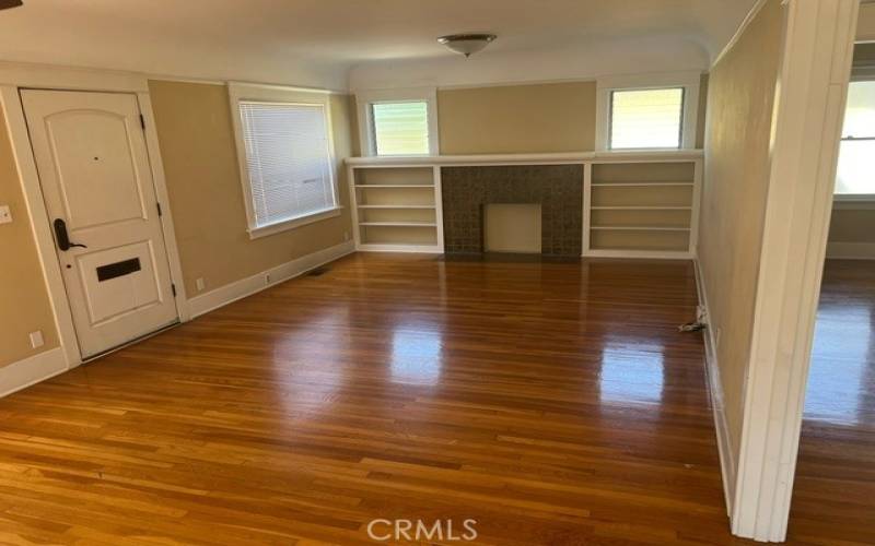 Charming living room with built-ins and a coved ceiling.