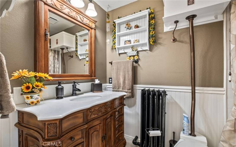 Guest Bathroom with Vintage inspired cabinet and mirror