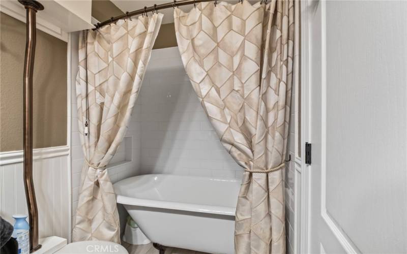 Guest bathroom with vintage inspired claw foot bathtub.