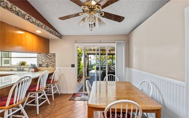 Dining room looking out into the patio with spa that stays with the home.