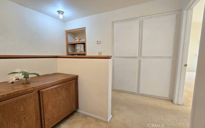 Hallway upstairs with cabinet space / linen closet