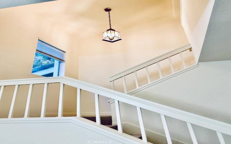 Stairs showing vaulted ceilings