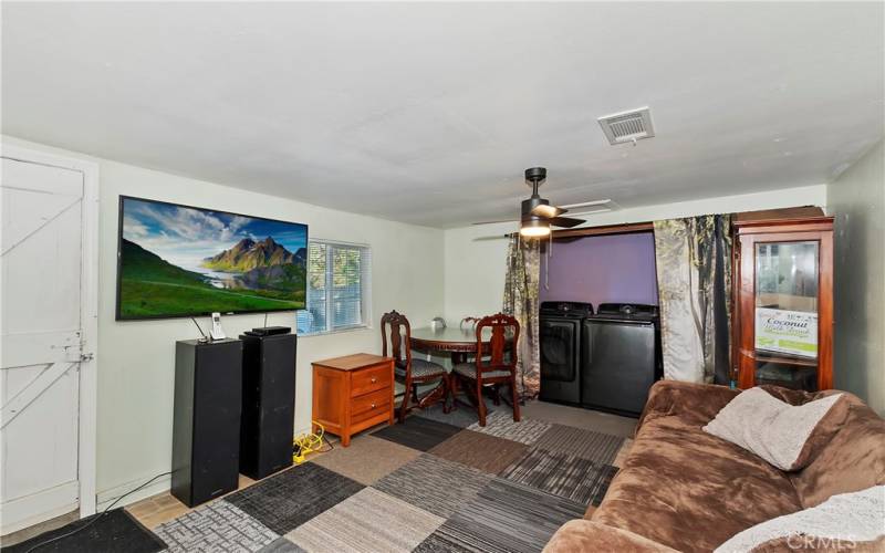 Unpermitted bonus room with its own wood burner that could be used as bedroom 3 or as a second family/game room.