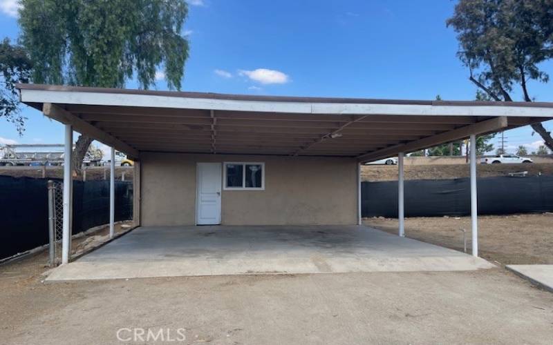 CARPORT AND STORAGE ROOM IN THE REAR