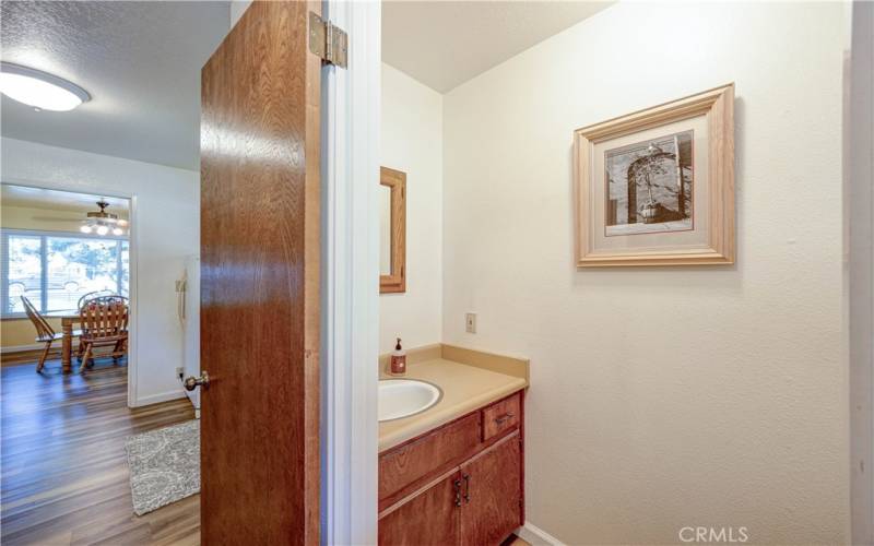 Half bath off laundry room and back door.