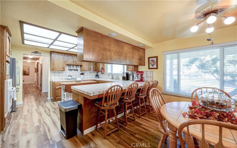 Large kitchen with dining area and nice eating bar.