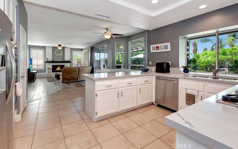 Kitchen updated with sparkling quartz counter tops and stainless steel appliances