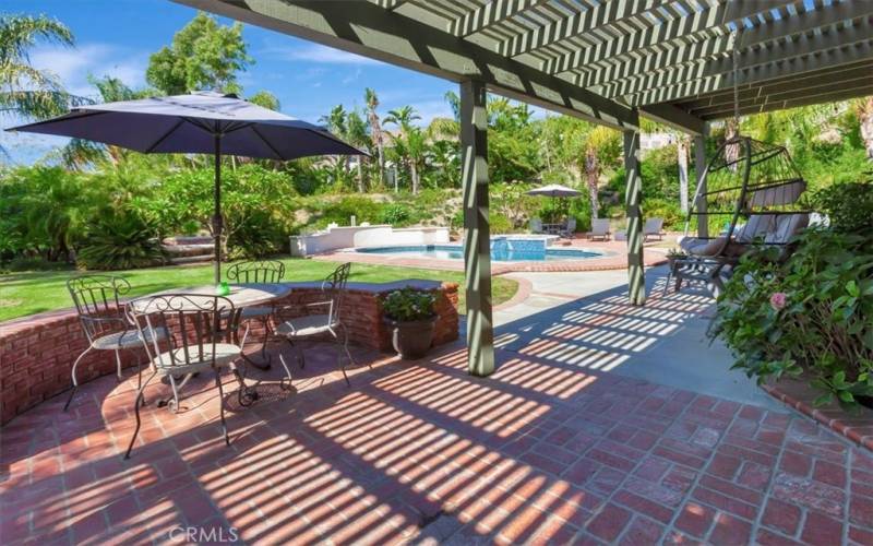 Covered patio looking onto lush beautiful yard