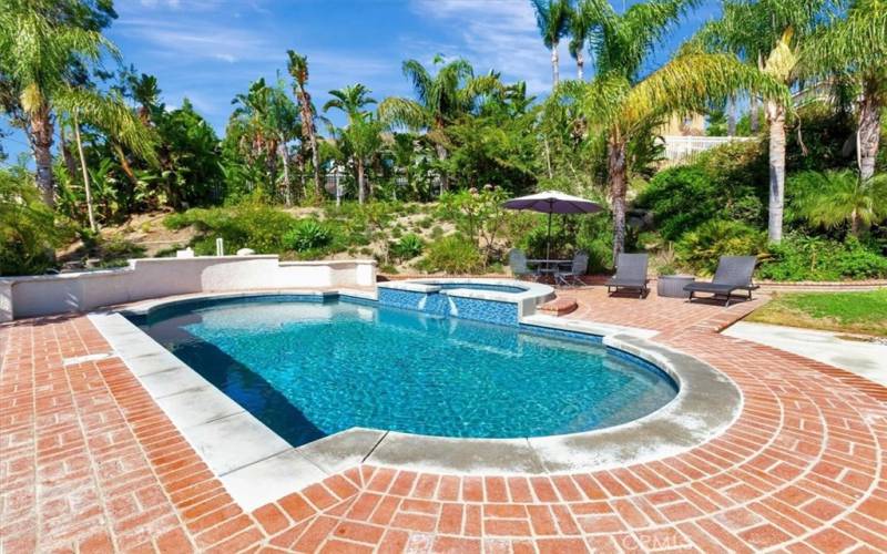 Pool and spa with brick surround