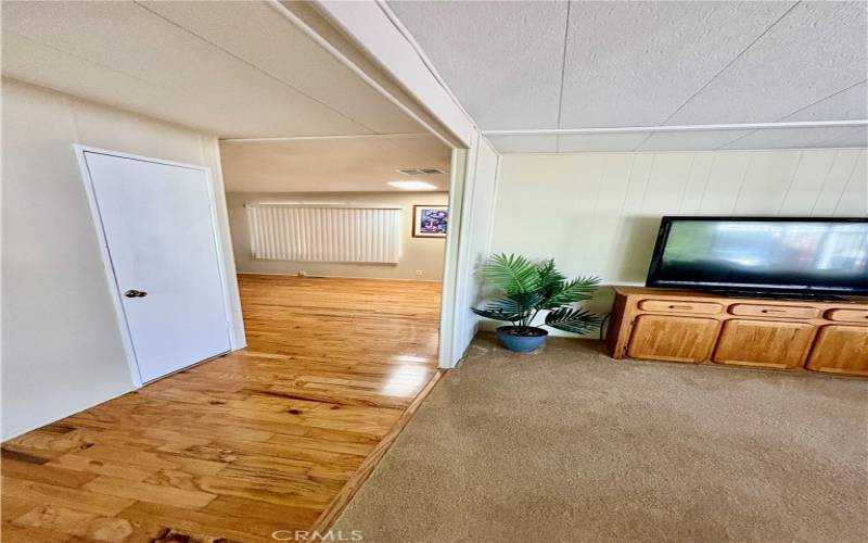 Entry way from front entrance to living room on right and family room straight ahead