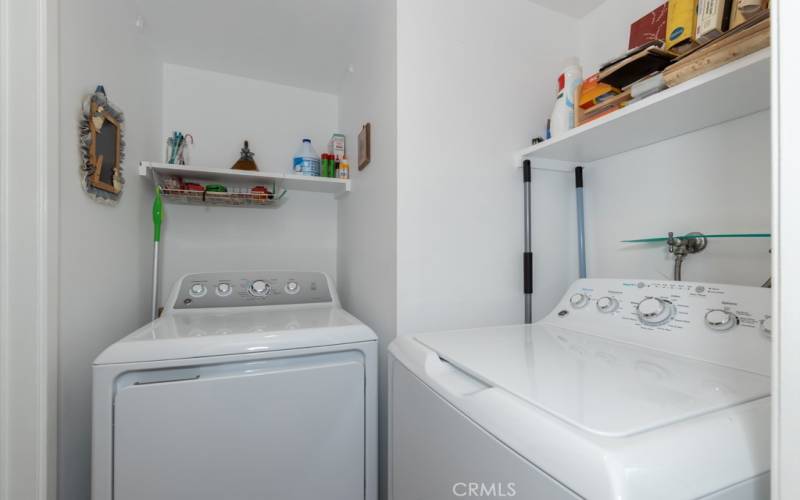 Just off of the kitchen is the inside laundry room