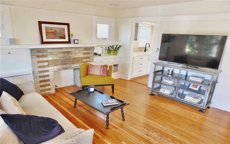 View of the living room seamlessly transitioning into the kitchen, showcasing an open and inviting layout.