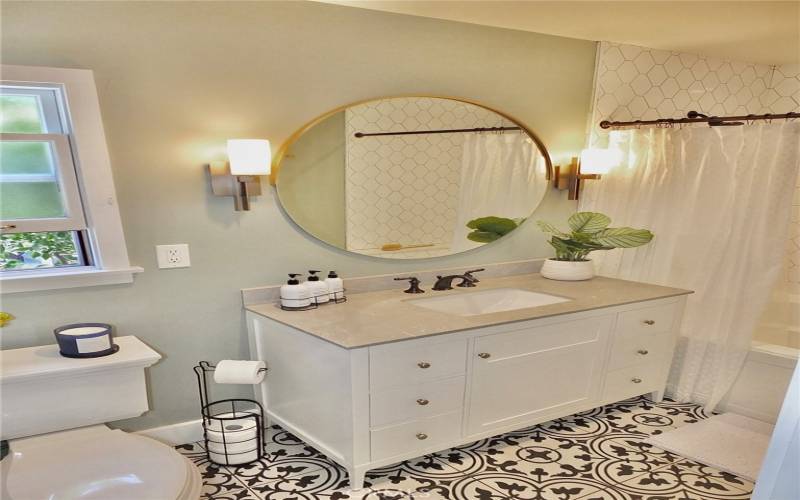 Stunning bathroom vanity offering ample storage in its spacious drawers 

Stunning bathroom vanity featuring ample storage in spacious drawers, complemented by a window that invites a refreshing breeze.