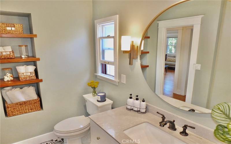 Convenient built-in storage area in the bathroom, maximizing space and organization 

