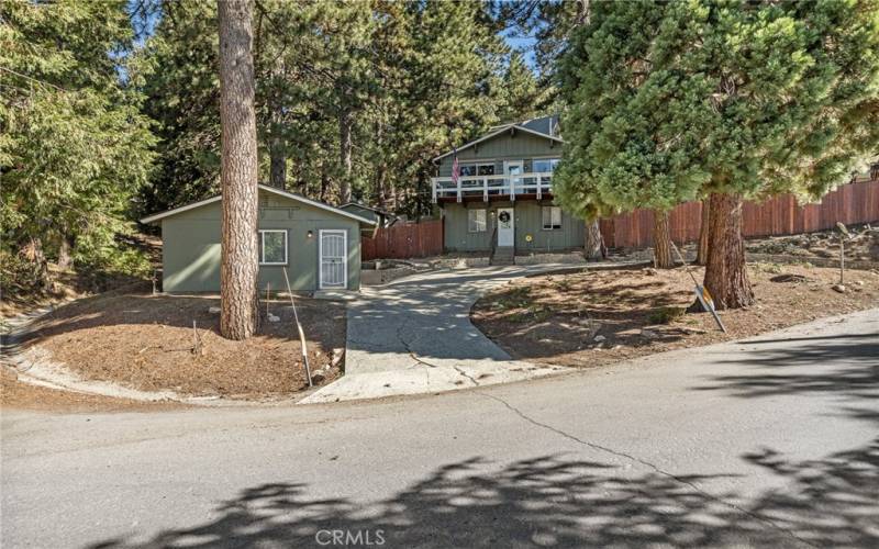 Driveway with plenty of parking. Separate guest room with converted garage.